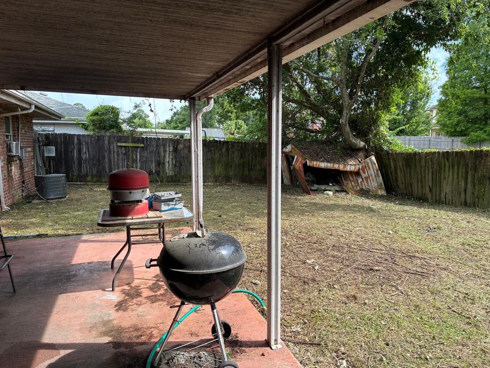 Cleaned patio after yard overgrowth removal