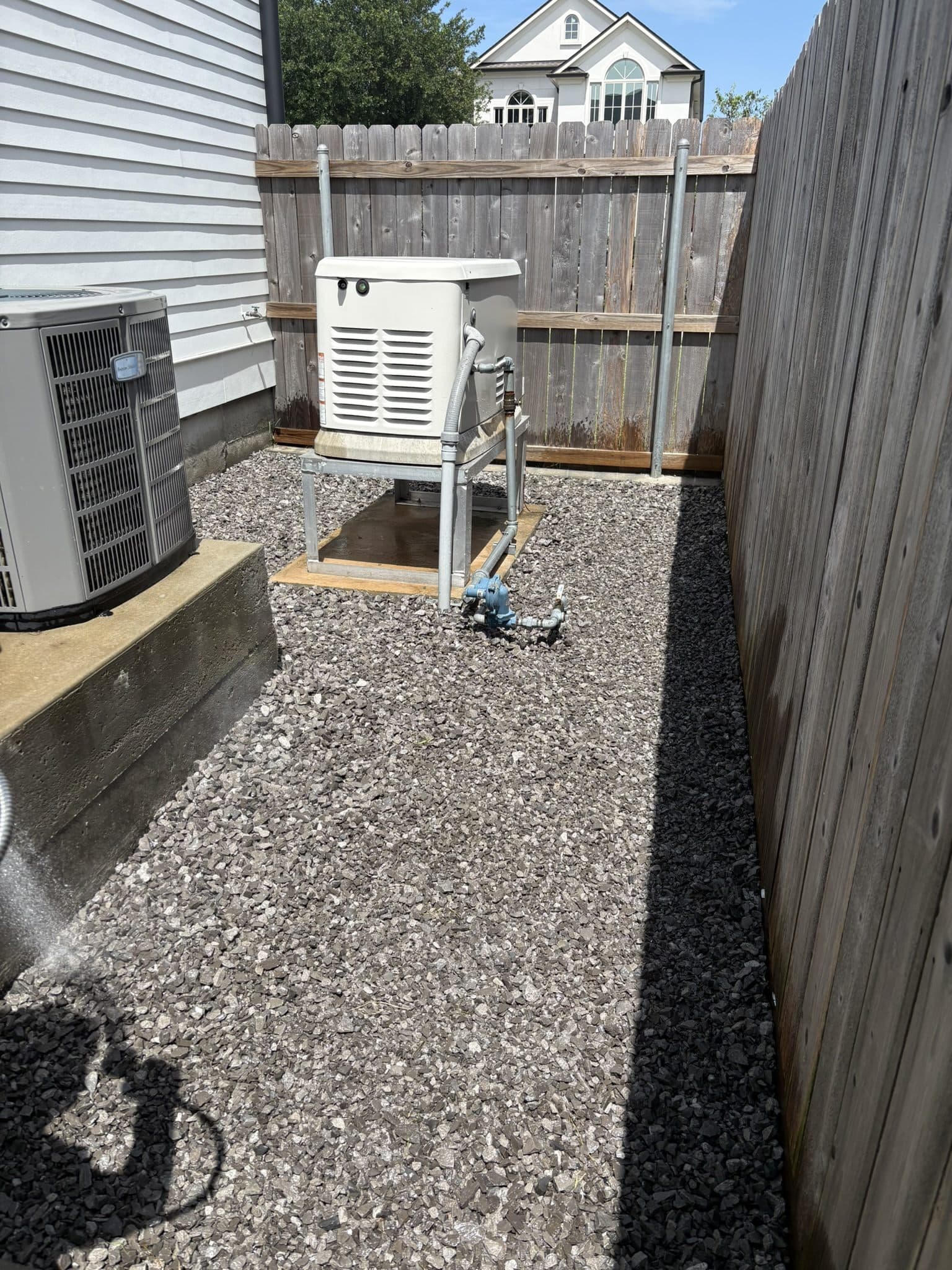 Gravel drainage area beside a house